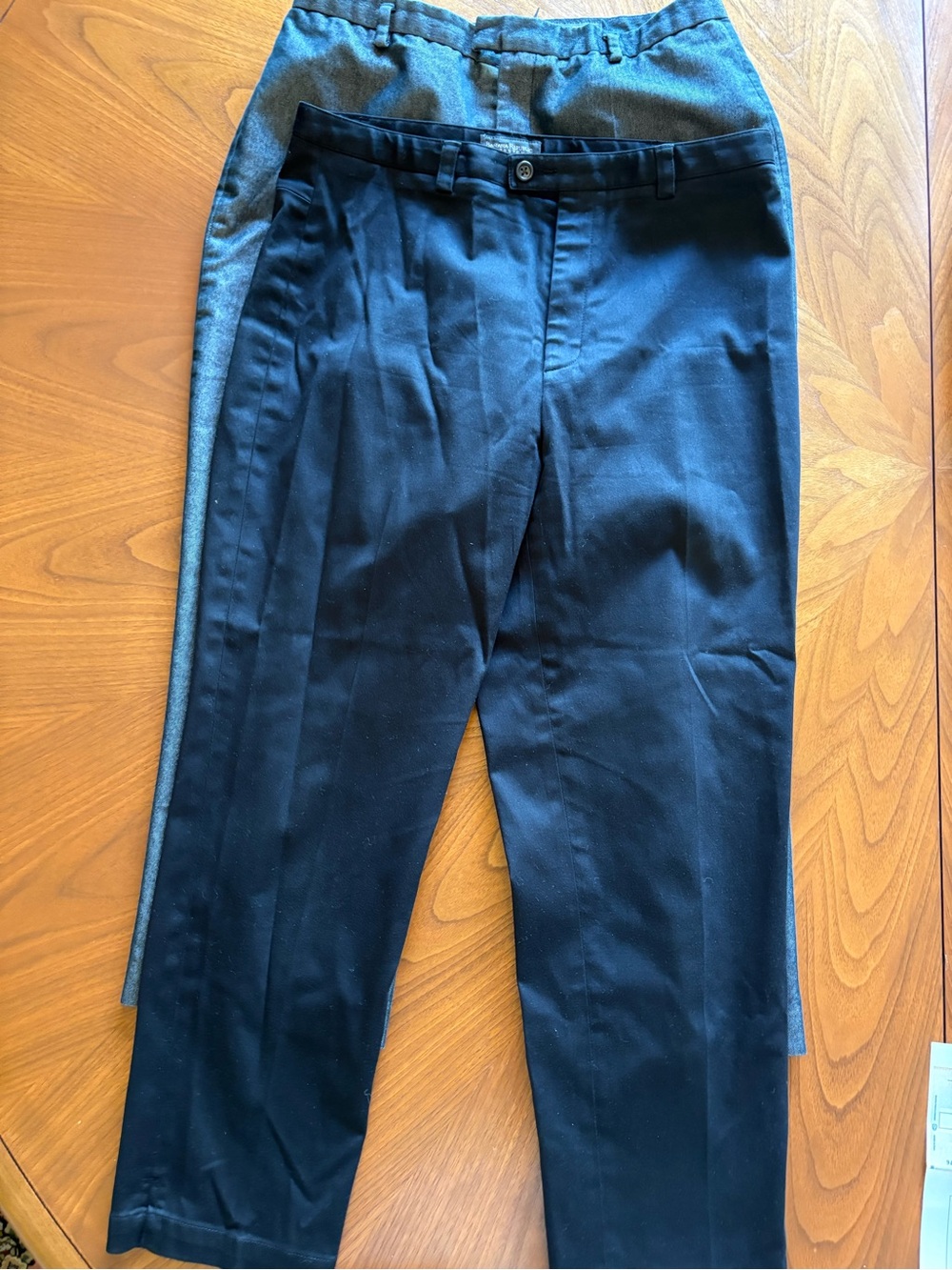 Two Stretch Pairs of Wide leg pants with pockets and elastic waist in back.